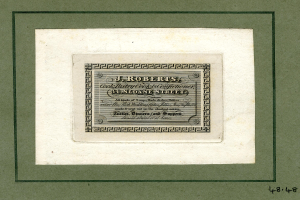 Ein Foto Rahmen mit einer Aktie mit dem Text "J.R. Roberts, Inc." und verschiedenen Zahlen.