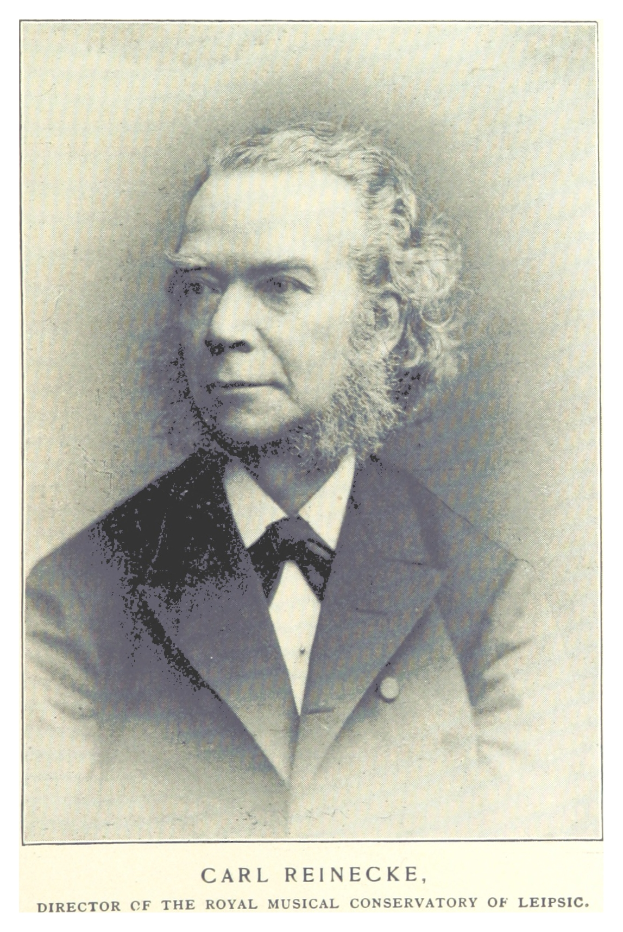 Schwarzes und weißes Foto von Carl Reinecke, Direktor des Königlichen Musik-Konservatoriums von Leipzig, der einen Anzug trägt, mit Text unten.