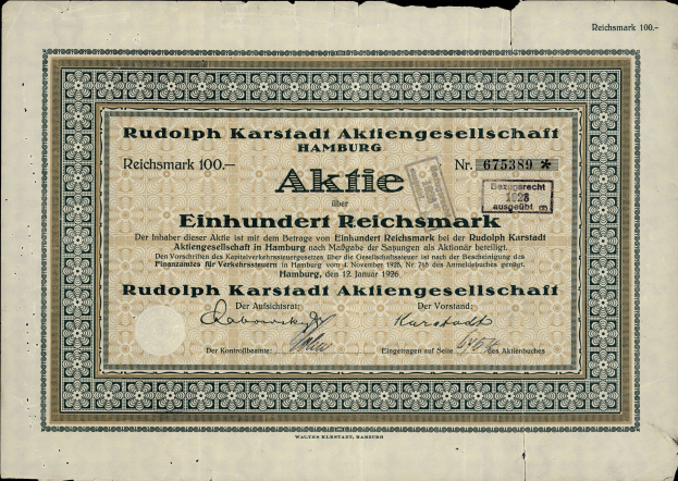Eine alte deutsche Banknote mit einem schwarzen Hintergrund und dem Text "Rudolph Karlstadt Aktiengesellschaft Hamburg" darauf.