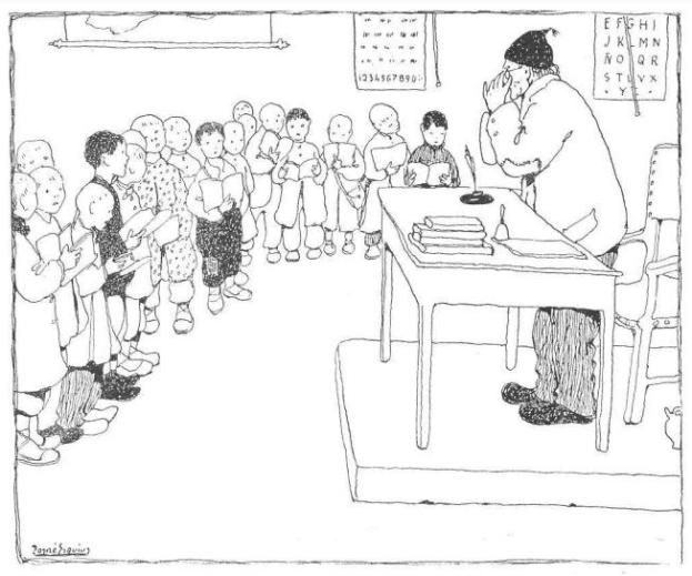 Ein Mann in Schuhen sitzt an einem Schreibtisch mit Büchern und Gegenständen, einer Gruppe von Kindern gegenüber, mit Papieren an der Wand hinter ihm.